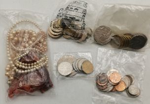 A quantity of assorted coinage, British and Foreign; and five necklaces