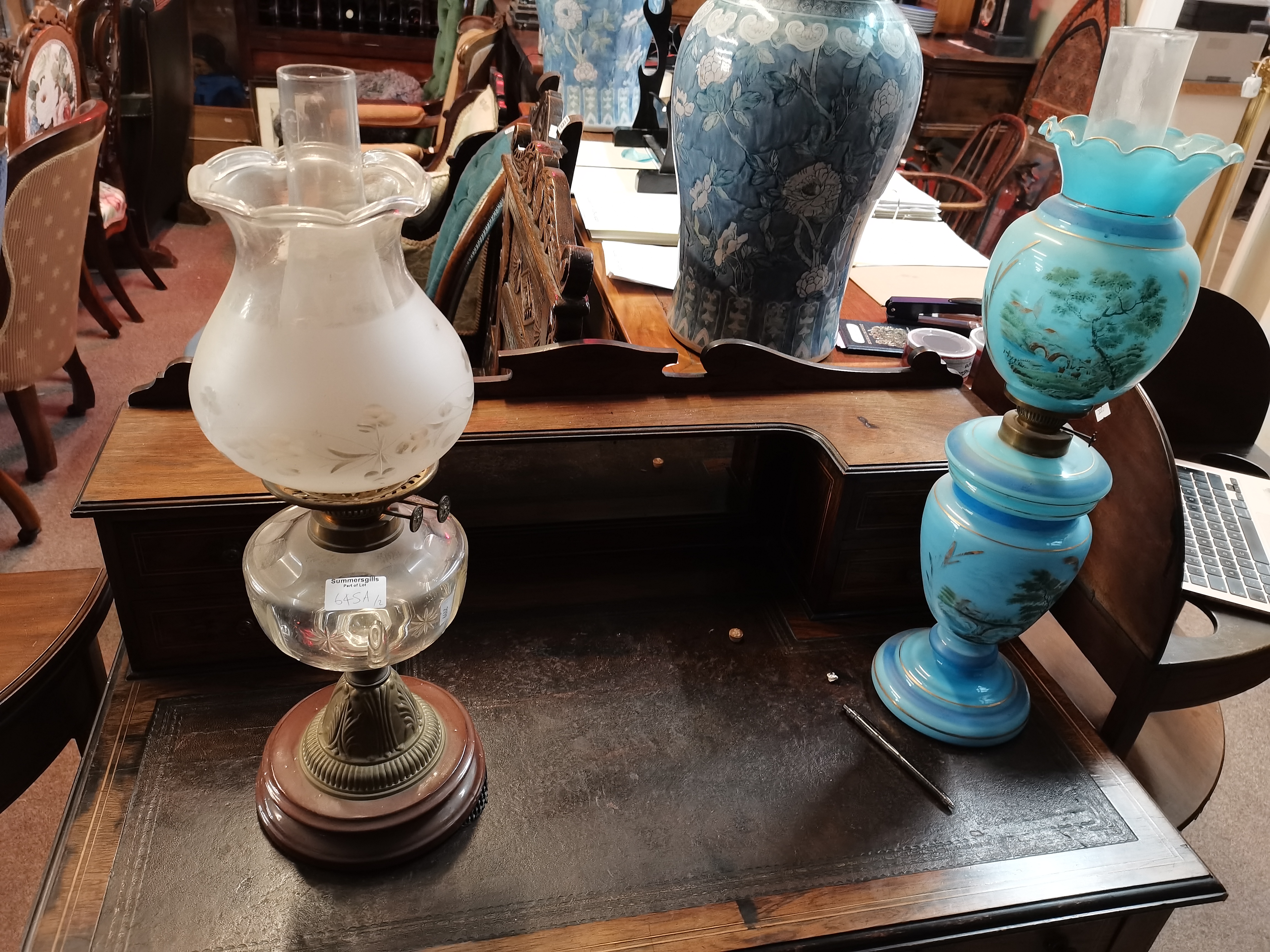 Two glass oil lamps