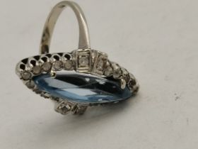 An 18 carat white gold navette diamond and aquamarine ring