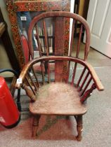 A Childs Windsor chair in elm