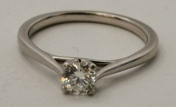A platinum and diamond solitaire ring