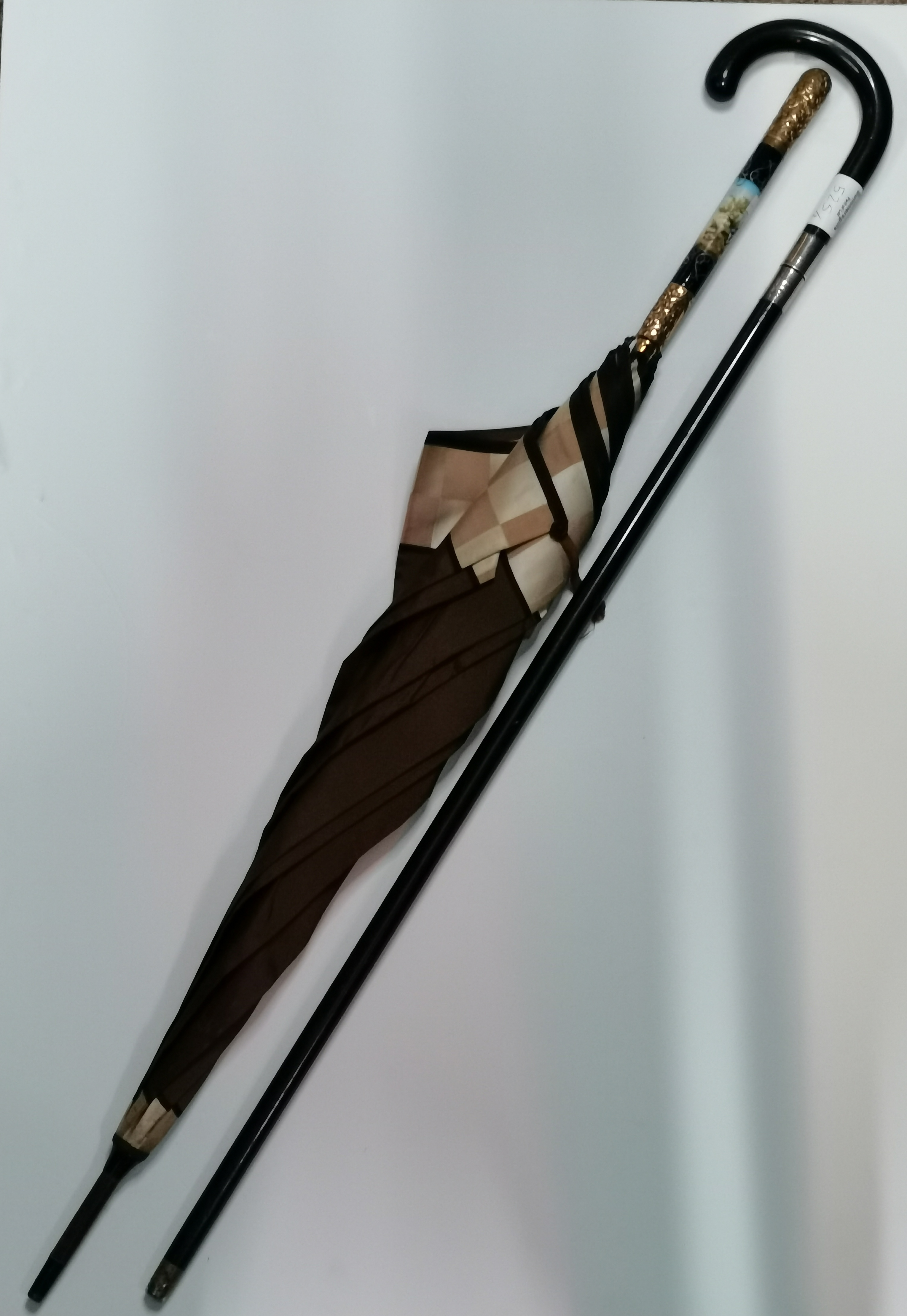 A George VI silver-mounted ebonised sword stick, and an 18ct gold-plated and enamel handled parasol