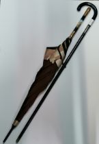 A George VI silver-mounted ebonised sword stick, and an 18ct gold-plated and enamel handled parasol