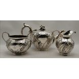 A Victorian silver three-piece bachelor's tea service