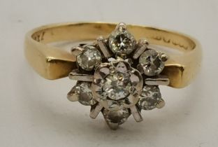 An 18 carat gold diamond cluster ring