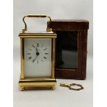 An English brass carriage clock with leather travel case, 20th Century