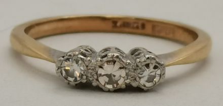 A 9 carat gold and platinum three-stone ring