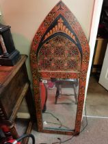 An Indian style wall mirror highly decorated and h