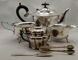 A group of silver-plated wares, including a three-piece tea service