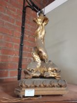 A gilt wooden figural table lamp