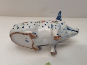 An early pottery pig in the style of WEMYSS together with an early Staffordshire sheep