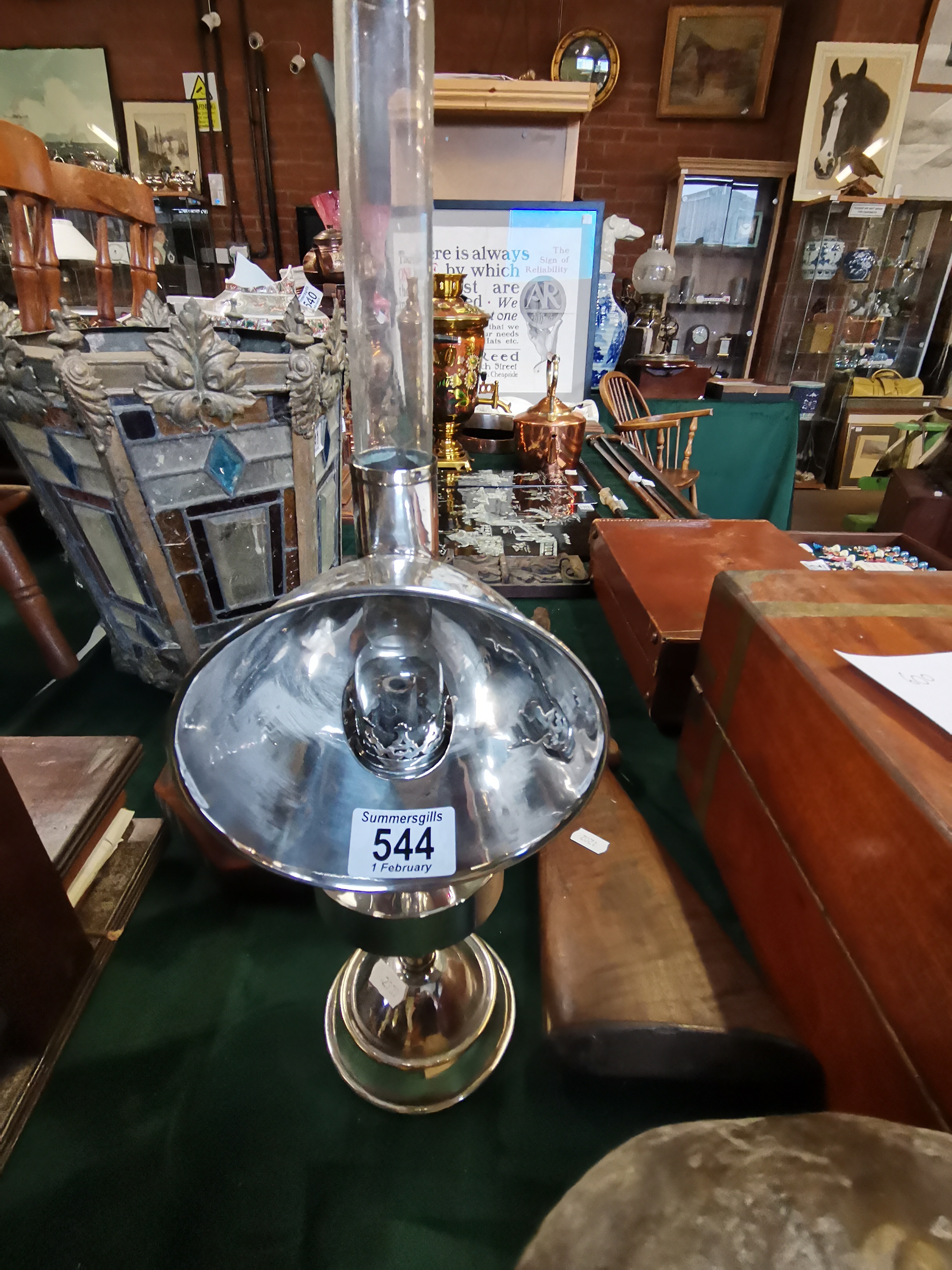 A chromed brass student's oil reading lamp and reflector hood