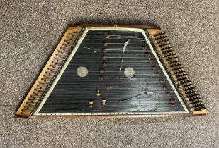 An inlaid mahogany hammered dulcimer