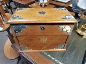 An oak smokers cabinet with opening top and revolv