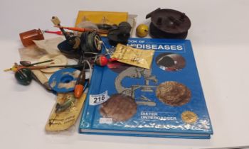 Box of fishing items, lures and book