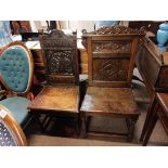 2 x early oak hall/ church chairs with carved deco