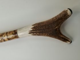 An antler handle walking thumb stick/staff