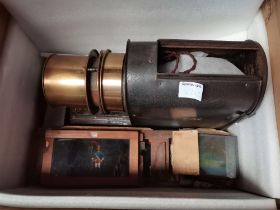 A Victorian magic lantern and slides