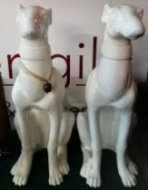 A pair of large greyhound models