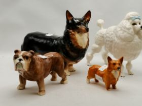 Three Beswick dog models, and a Sylvac model