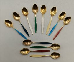 Georg Jensen: A set of twelve Danish silver-gilt and harlequin enamel coffee spoons