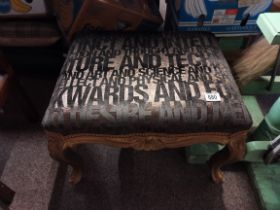 An antique gilt dressing stool with newly recovered fabric seat