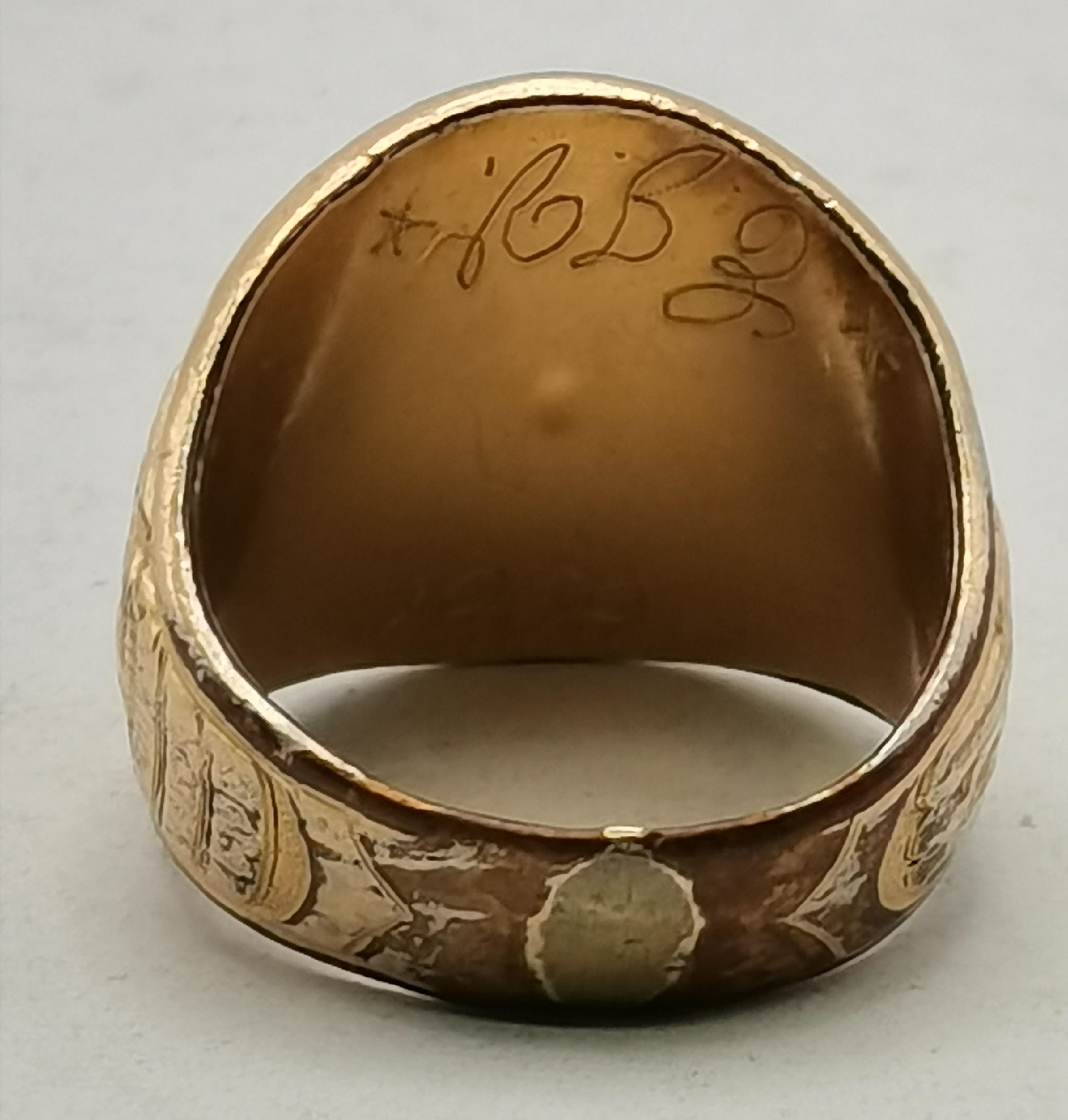 An Elizabeth II silver ingot pendant, and a gold-plated US Navy ring - Image 4 of 4