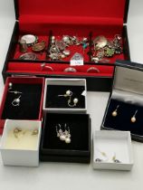 A quantity of assorted jewellery including earrings, brooches, etc.