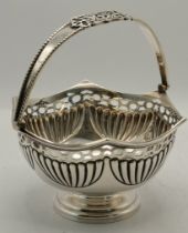 An Edwardian silver hexagonal swing-handle sugar basket