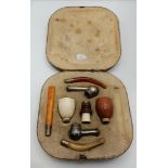 A late 19th/early 20th Century interchangeable smoking pipe set, cased