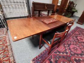 A.H.McIntosh & Co Ltd: A mid-century rosewood extending dining table and six chairs