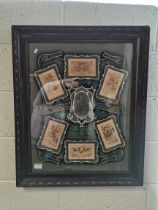 Antique framed silk embroideries in commemorative setting