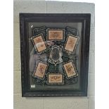 Antique framed silk embroideries in commemorative setting