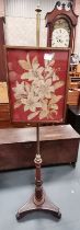 An Antique Regency rosewood pole screen with brass inlaid decoration