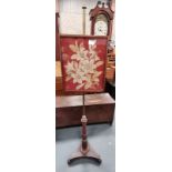 An Antique Regency rosewood pole screen with brass inlaid decoration
