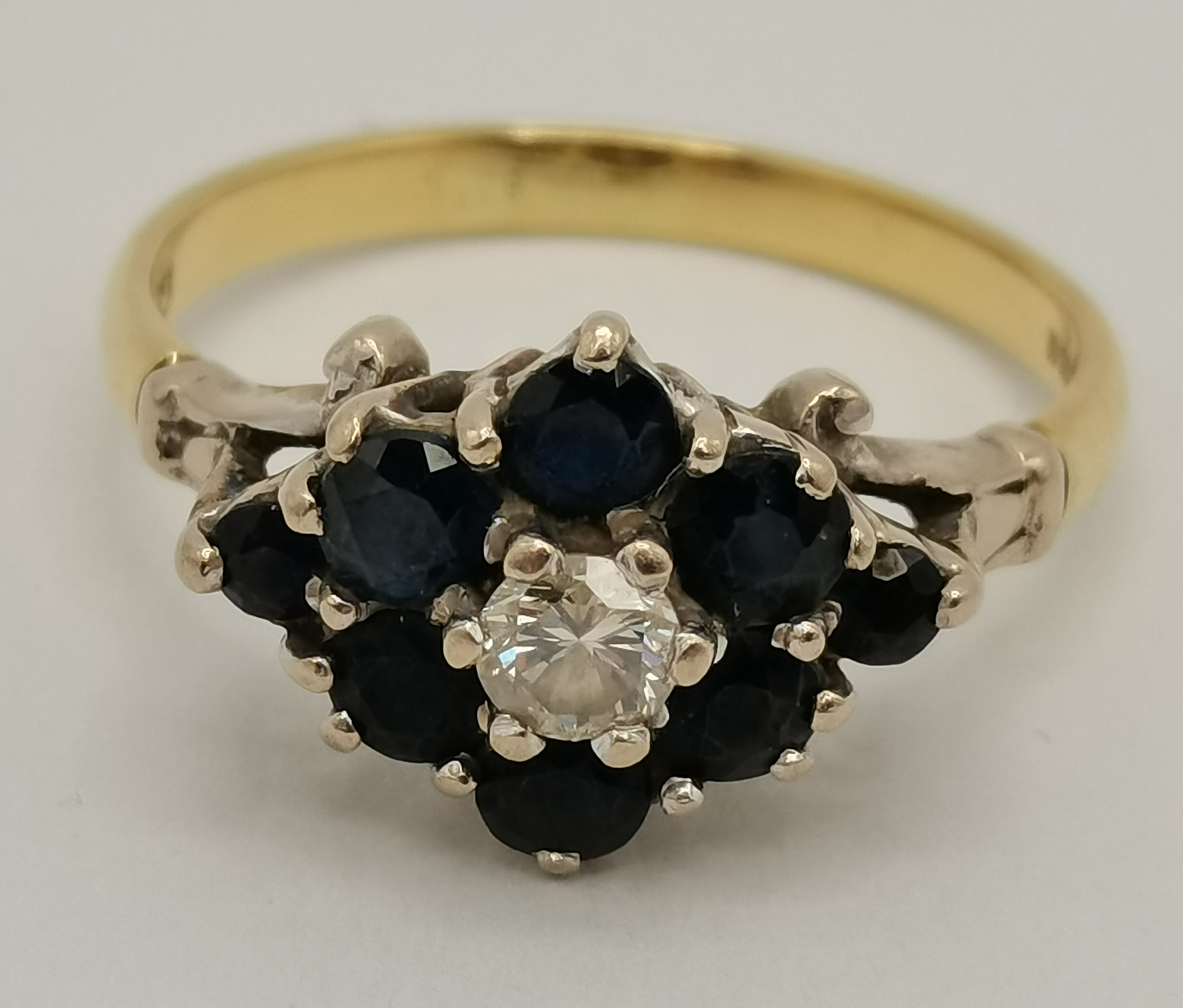 An 18 carat gold blue and white stone cluster ring, and a 9 carat gold white three stone ring - Image 6 of 9