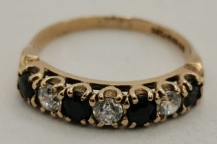 A 9 carat gold sapphire and diamond seven-stone ring