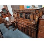 A 20th century oak court cupboard, dining table and 4 chairs