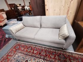 An upholstered four-seater settee