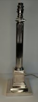 A silver-plated Doric column table lamp