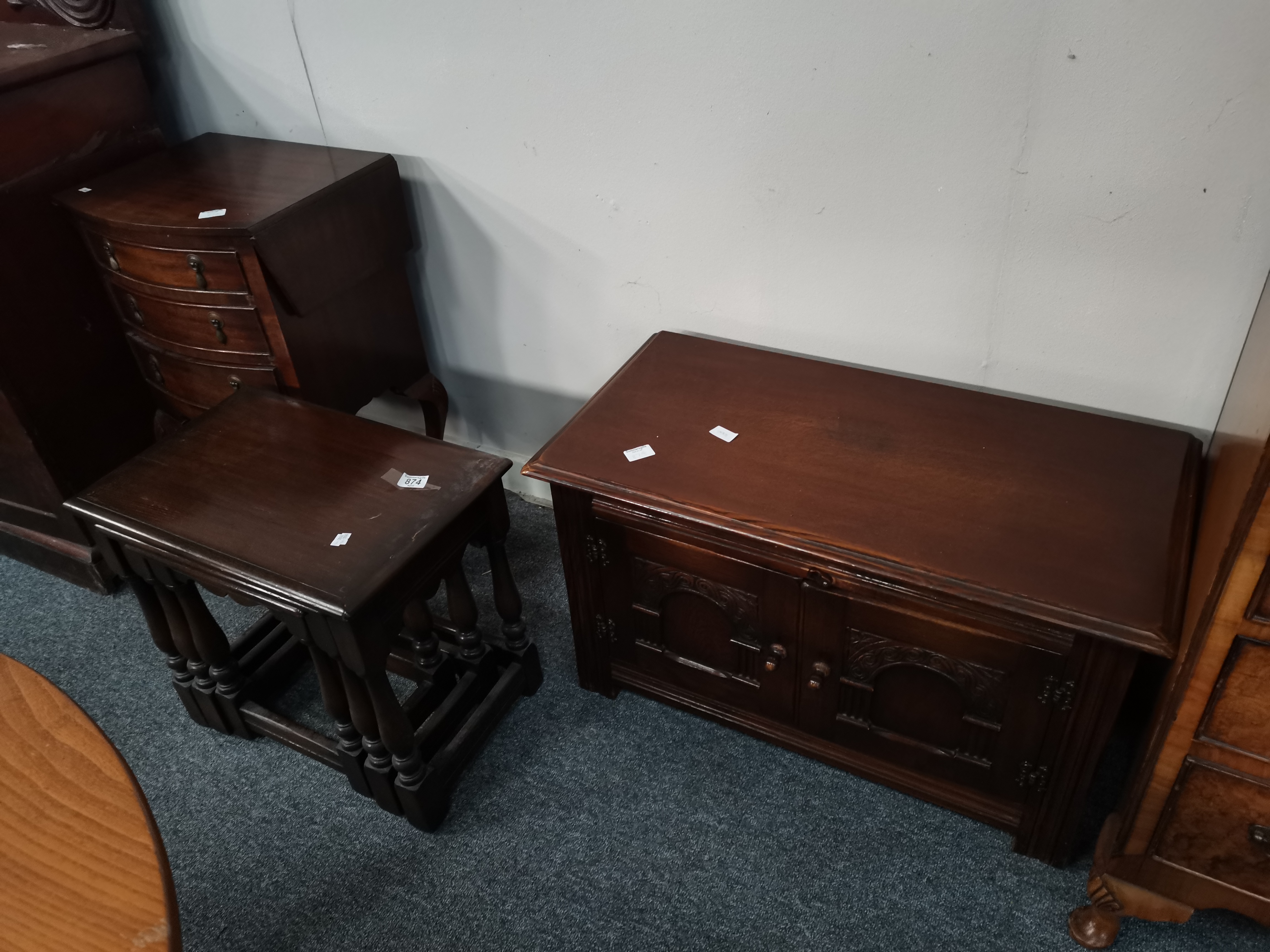 A mahogany bedside cabinet, plus an oak nest of ta