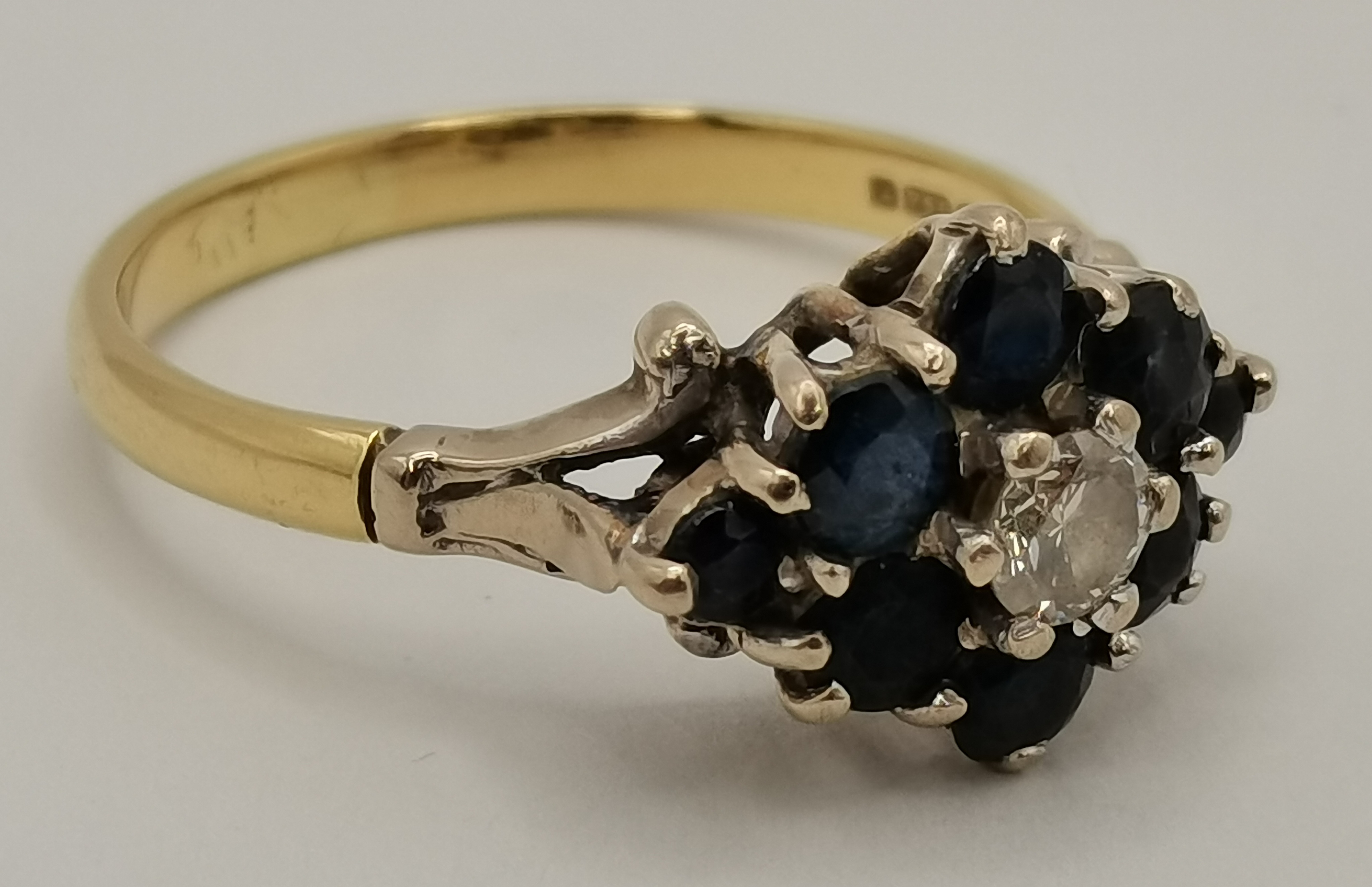An 18 carat gold blue and white stone cluster ring, and a 9 carat gold white three stone ring - Image 7 of 9