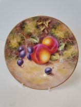A Royal Worcester side plate by John Freeman