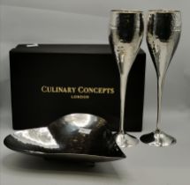 A pair of silver-plated champagne flutes, and a heart-shaped dish