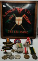 A quantity of assorted WWI and WW2 medals, embroidered insignia, etc.