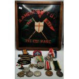 A quantity of assorted WWI and WW2 medals, embroidered insignia, etc.