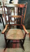 A reproduction of an early rocking chair with turn