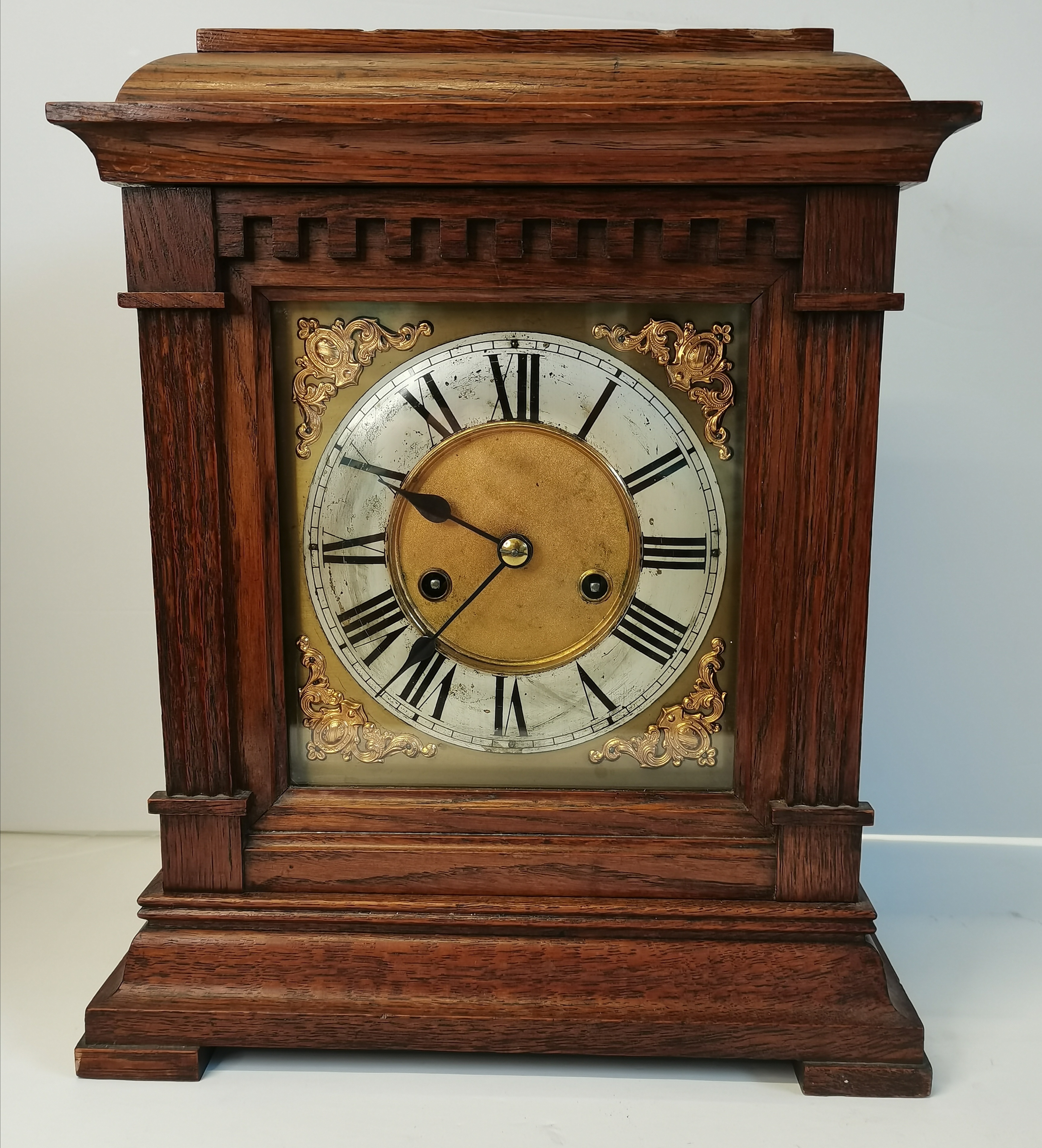 An oak cased bracket clock