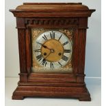 An oak cased bracket clock