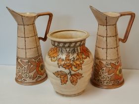 A pair of Charlotte Rhead water jugs and A Crown Devon vase